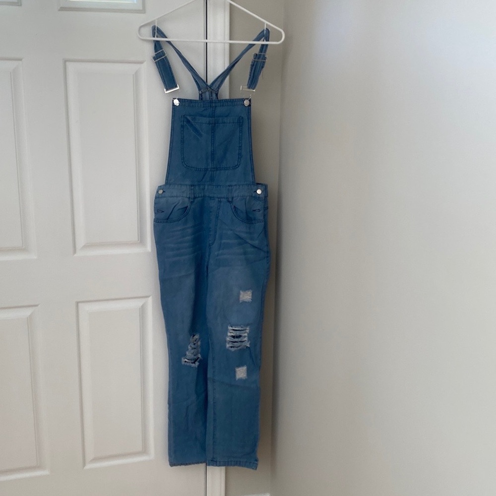 Ripped denim overalls